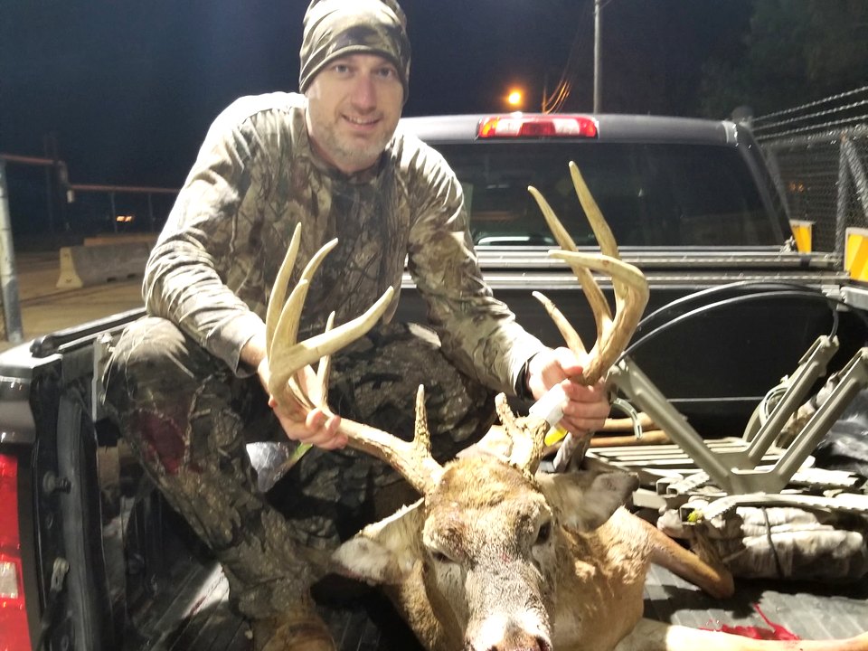 Tom Hahn with an Iowa buck in the truck bed